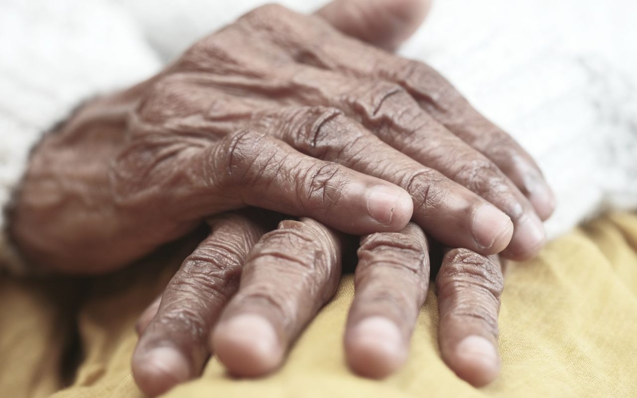Close-up of an older adult's hands at rest