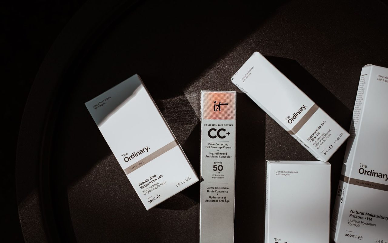 Assorted unbranded skincare products in soft light