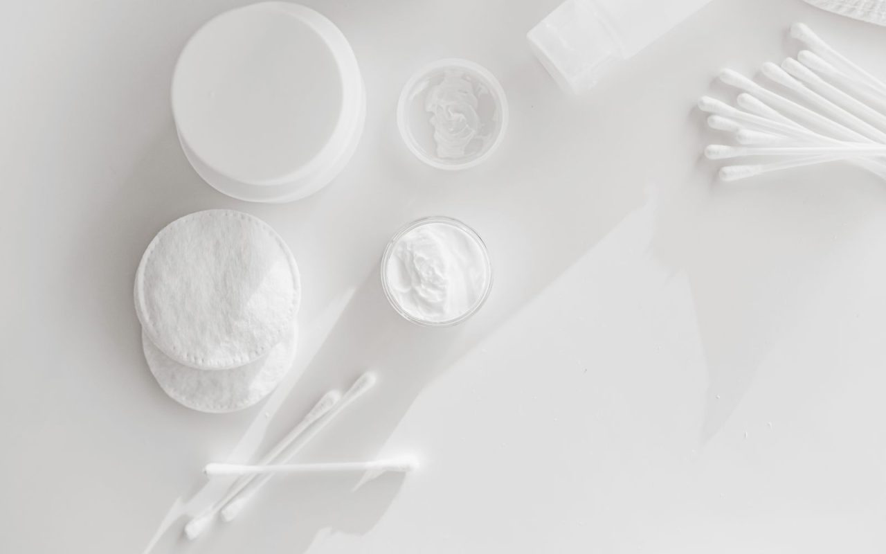 Cotton pads and cotton swabs on a white background