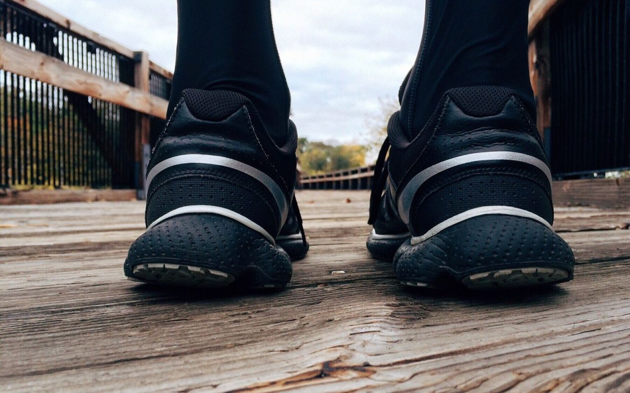 Running shoes on a wooden bridge