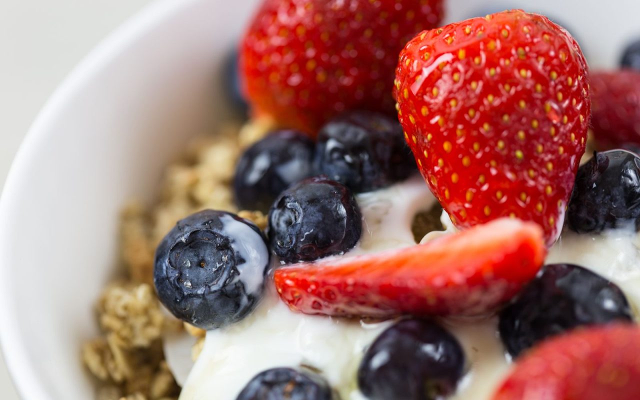 Yogurt topped with berries and granola